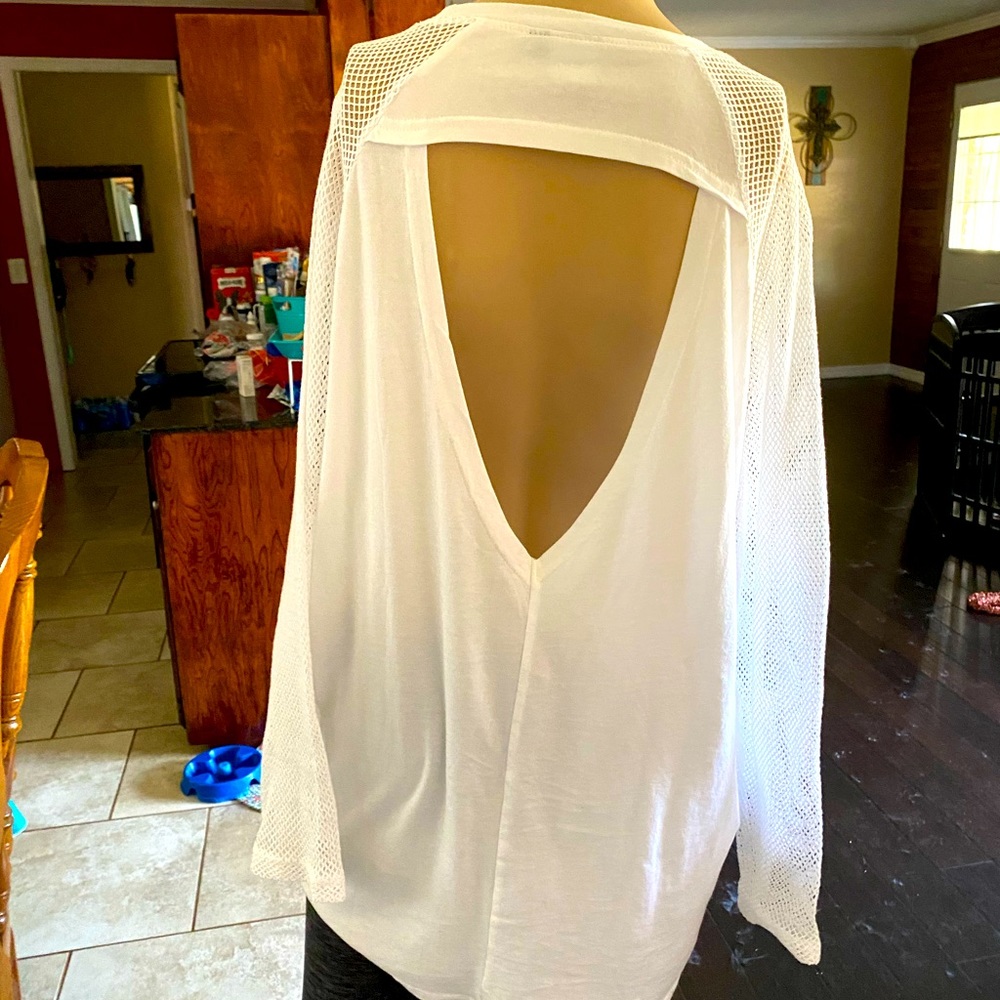 White cute long sleeve with back cut out. Like new